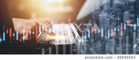 businessman hand type on the laptop of company profit with colleagues partner explain with virtual dashboard statistic chart stock infographic, graphs, cryptocurrency, and new trading platforms 98849265