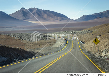 Road in Moon Valley dramatic landscape at Sunset, Atacama Desert, Chile 98849887