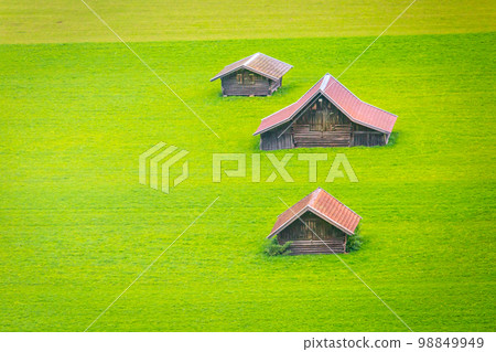 Bavarian alps and rustic farm barns for agriculture, Garmisch, Bavaria, Germany Bavarian alps and rustic farm barns for agriculture, Garmisch, Bavaria, Germany 98849949