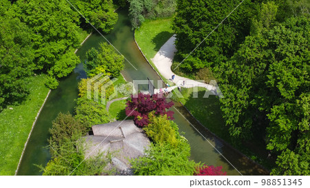 Flight over the English Garden in the city of Munich aerial view from above Flight over the English Garden in the city of Munich aerial view from above 98851345
