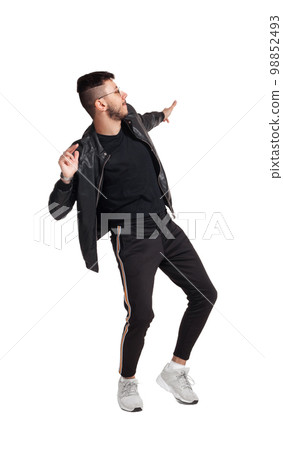Full-length photo of a funny guy dancing in studio isolated on white background. Full-length photo of a funny guy dancing in studio isolated on white background. 98852493