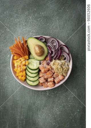 Poke bowl with quinoa and salmon and raw vegetables Poke bowl with quinoa and salmon and raw vegetables 98852606