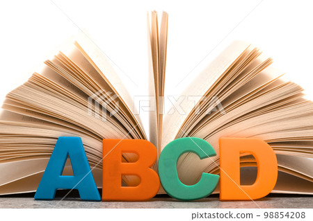 Alphabet letters ABCD and open book 98854208