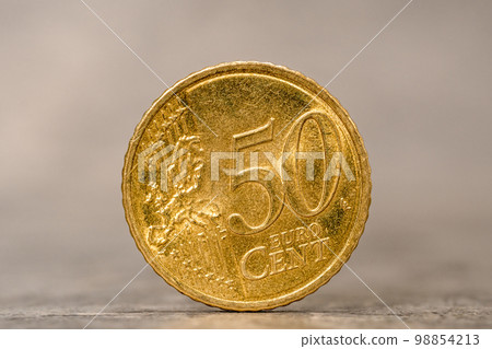 Fifty Euro cent coin on the grey stone background Fifty Euro cent coin on the grey stone background 98854213