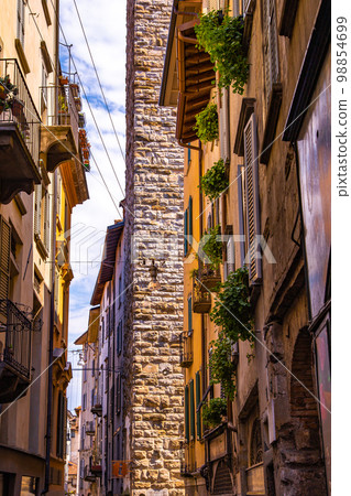 Street view of Bergamo old town, italian city northeast of Milan, in the Lombardy region . Street view of Bergamo old town, italian city northeast of Milan, in the Lombardy region . 98854699