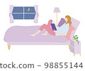 woman reading before bed 98855144