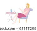 A woman relaxing at a cafe 98855299