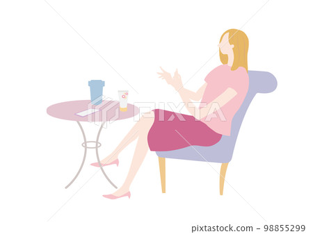 A woman relaxing at a cafe 98855299
