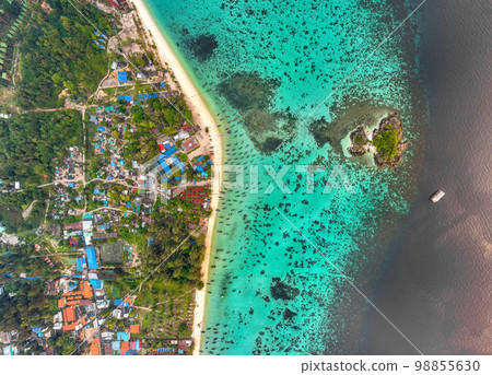 Aerial view of Sunrise beach with long tail boats in Koh Lipe, Satun, Thailand Aerial view of Sunrise beach with long tail boats in Koh Lipe, Satun, Thailand 98855630