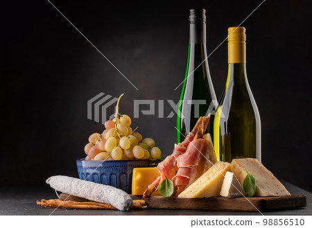 Antipasto board with various cheese and snacks Antipasto board with various cheese and snacks 98856510