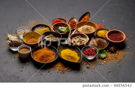 Various spices in bowls and spoons Various spices in bowls and spoons 98856542