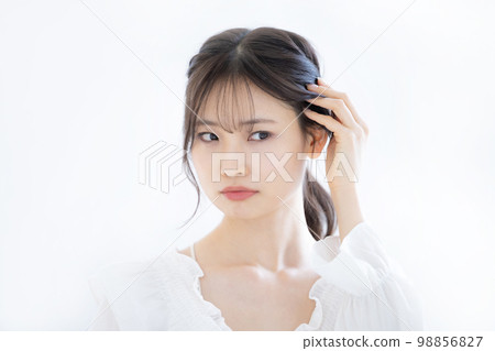 Portrait beauty of a young woman on a white background Portrait beauty of a young woman on a white background 98856827
