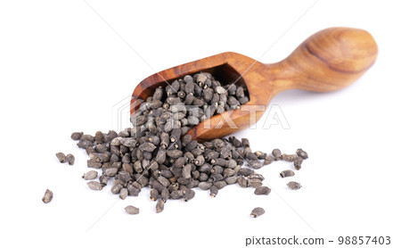 Borage seeds in wooden scoop, isolated on a white background. Borago officinalis seeds. 98857403