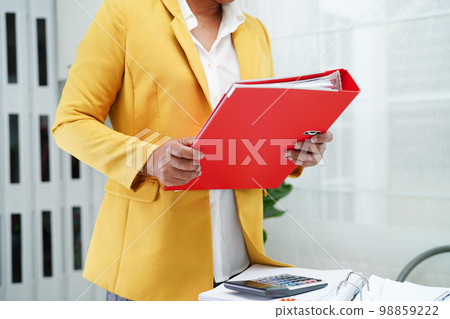 Business woman busy working with documents in office. 98859222