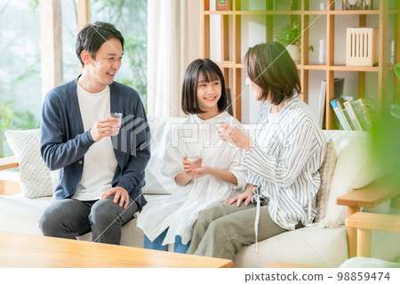 family drinking delicious water family drinking delicious water 98859474