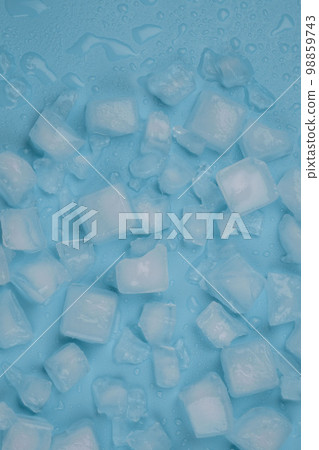 Rotating blue background with ice cubes and water drops. High quality 4k footage Rotating blue background with ice cubes and water drops. High quality 4k footage 98859743