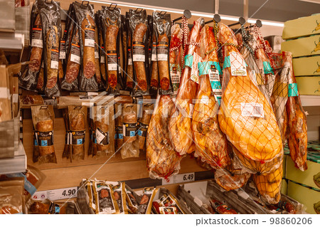 Spanish hamon in barcelona market, jamon iberico in view black leg pork isolated, traditional national spain meat in store, serrano prosciutto food on background gastronomy, bacon berian on cuisine Spanish hamon in barcelona market, jamon iberico in view black leg pork isolated, traditional national spain meat in store, serrano prosciutto food on background gastronomy, bacon berian on cuisine 98860206