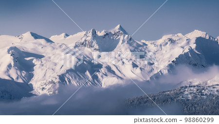 Snow and Cloud covered Canadian Nature Landscape Background. Whistler 98860299