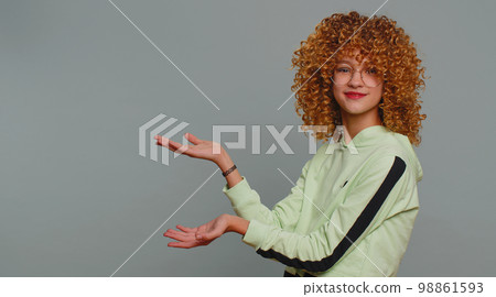 Girl child pointing empty place advertising area for commercial text, copy space for goods promotion 98861593
