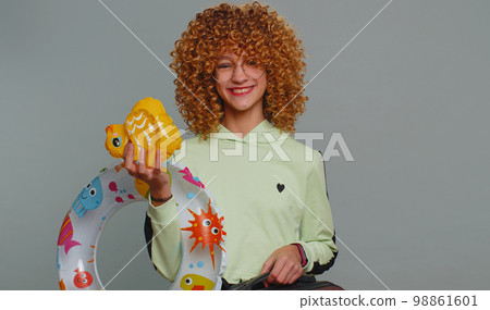 Girl pretending to be a tiger, imitate lion shout roar, making cats claws scratching moves, flirting Girl pretending to be a tiger, imitate lion shout roar, making cats claws scratching moves, flirting 98861601