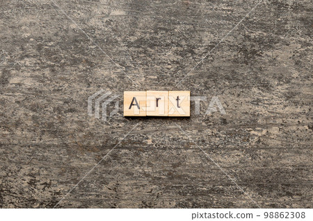 art word written on wood block. art text on cement table for your desing, concept 98862308