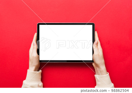 female teen hands using tablet pc with white screen, Mockup image of woman hand holding white tablet pc with blank white screen at home 98862504