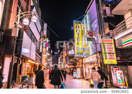 The cityscape of Tokyo, Japan, overlooking the west exit of Ikebukuro Station, Chuo-dori, West 1st Avenue, etc. White signboard, hotel... 98862661