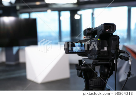 Modern video recording studio with professional equipment, focus on camera Modern video recording studio with professional equipment, focus on camera 98864318
