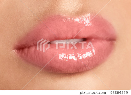 Young woman with beautiful full lips on white background, closeup 98864359