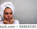 teenage girl with acne on her face. 98864580