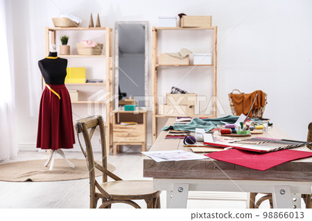 Fashion designer's workplace in studio. Creating new clothes 98866013