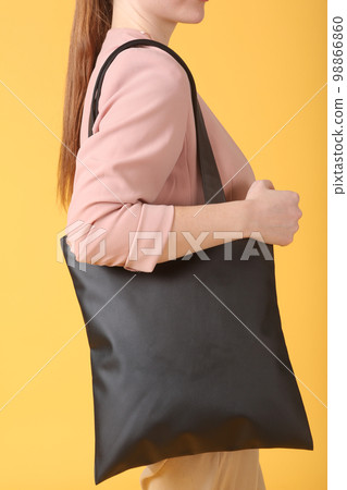 faux leather white shopper bag close up photo with model hand and face faux leather white shopper bag close up photo with model hand and face 98866860
