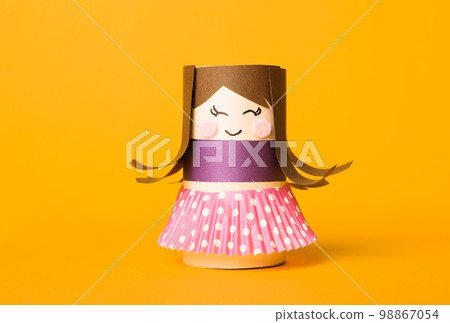 Doll and unicorn made of toilet paper among stationery on white wooden table, flat lay 98867054