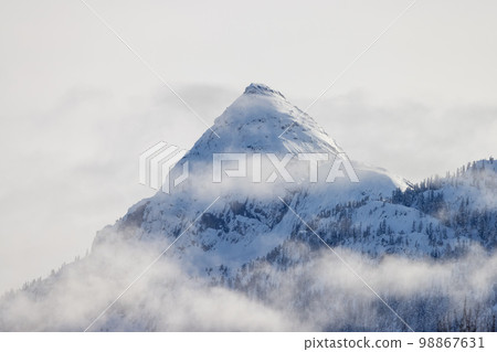 Snow and Cloud covered Canadian Nature Landscape Background Snow and Cloud covered Canadian Nature Landscape Background 98867631