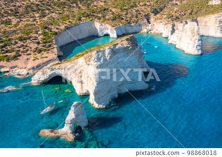Kleftiko Bay, a scenic attraction with white volcanic rocks and caves. Milos Island, Greece Kleftiko Bay, a scenic attraction with white volcanic rocks and caves. Milos Island, Greece 98868018