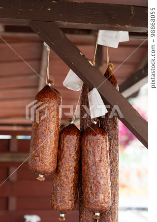 Hanging Smoked Sausage, Dried Salami, Chorizo, Wurst, Poland Kielbasa, Frankfurt Sausage on Village Market Hanging Smoked Sausage, Dried Salami, Chorizo, Wurst, Poland Kielbasa, Frankfurt Sausage on Village Market 98868055