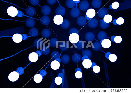 Hanging LED Light Bulbs on Blurred Background, Energy Saving Lamp Hanging LED Light Bulbs on Blurred Background, Energy Saving Lamp 98868321