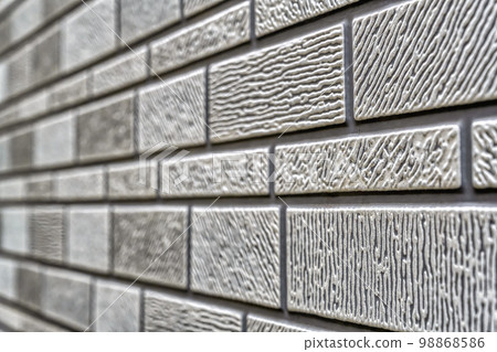 Exterior wall with patterned stone pattern siding, Yokohama Exterior wall with patterned stone pattern siding, Yokohama 98868586