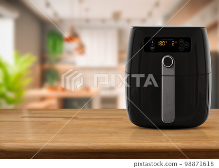 Air fryer machine cooking potato fried in kitchen. Lifestyle of new normal cooking.. 98871618