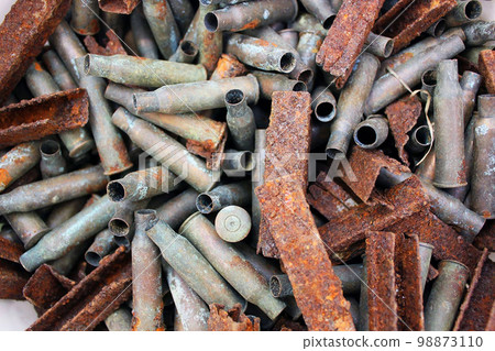 Abstract background from old rusty rifle cartridges. Abstract background from old rusty rifle cartridges. 98873110
