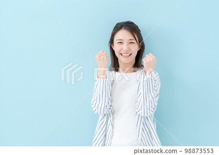 Female casual blue back guts pose Female casual blue back guts pose 98873553