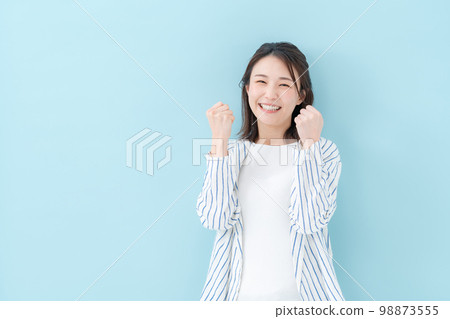 Female casual blue back guts pose Female casual blue back guts pose 98873555