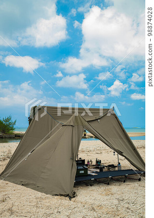 solo camping tent sand beach sea camping blue sky adventure beach 98874028