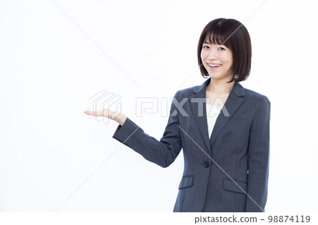 A business woman in her thirties who is introducing 98874119