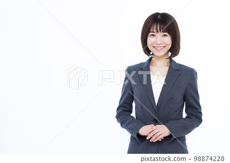 Business woman in her thirties with a smile Business woman in her thirties with a smile 98874228
