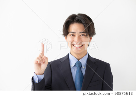Business suit smile pointing 98875618