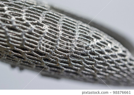 Model printed on 3D printer for metal close-up macro. Three-dimensional model printed on metal 3D printer. Model printed laser sintering machine for metal. Form printed by selective laser melting 98876661
