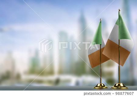 Small flags of the Ireland on an abstract blurry background Small flags of the Ireland on an abstract blurry background 98877607