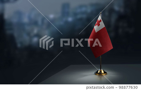 Small flags of the Tonga on an abstract blurry background 98877630