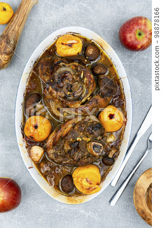 Pork knuckle prepared in sauerkraut. 98878166